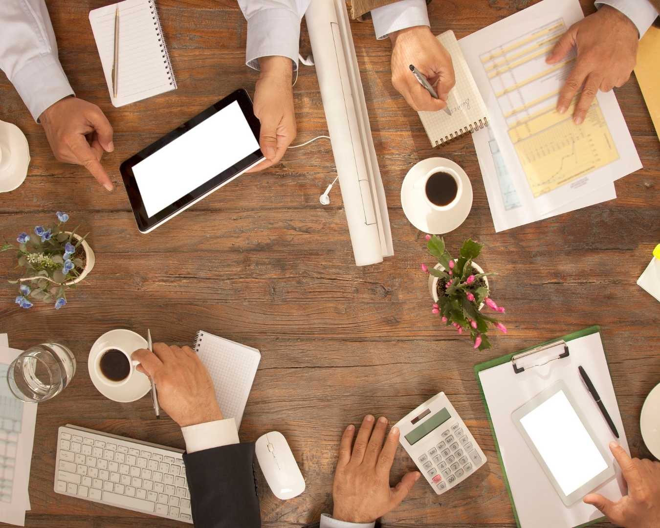 Bird's eye view - Board meeting at a desk
