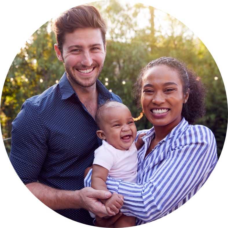 Happy young couple with baby - portrait